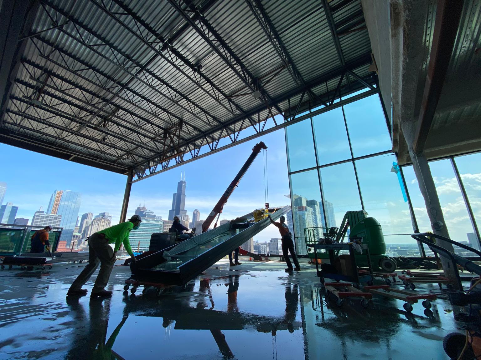 SPYDERCRANE mini crane on a high-rise floor