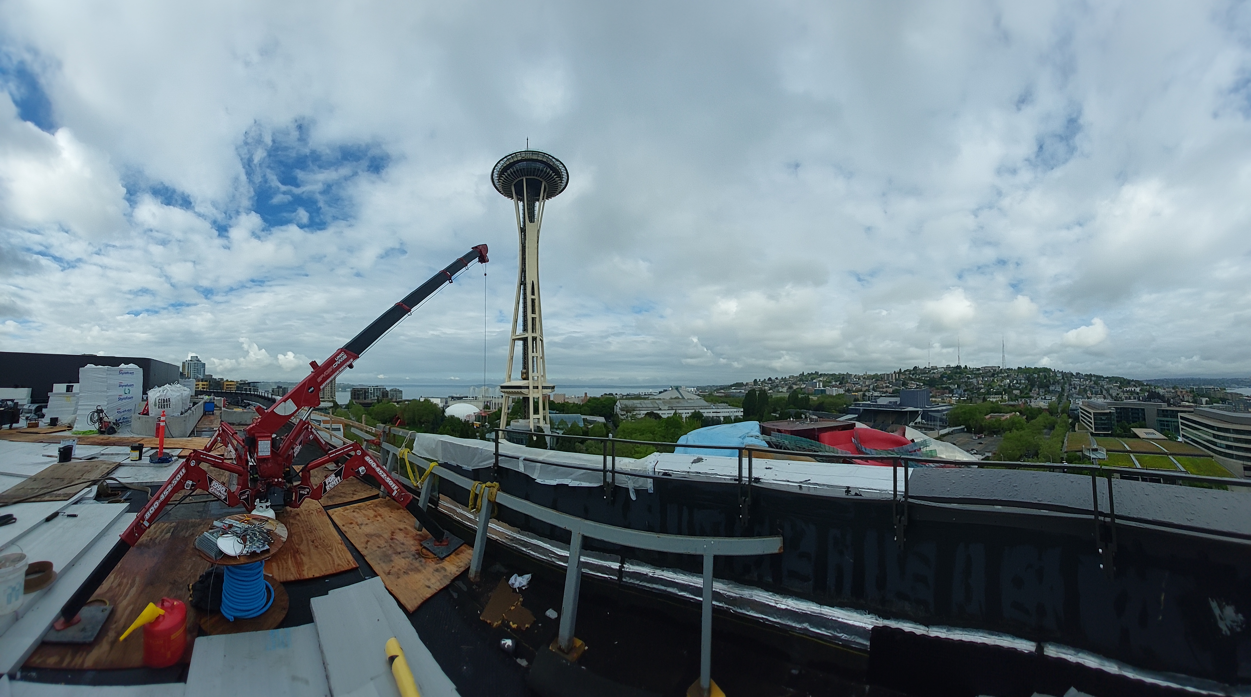 SPYDERCRANE mini crane on a rooftop jobsite