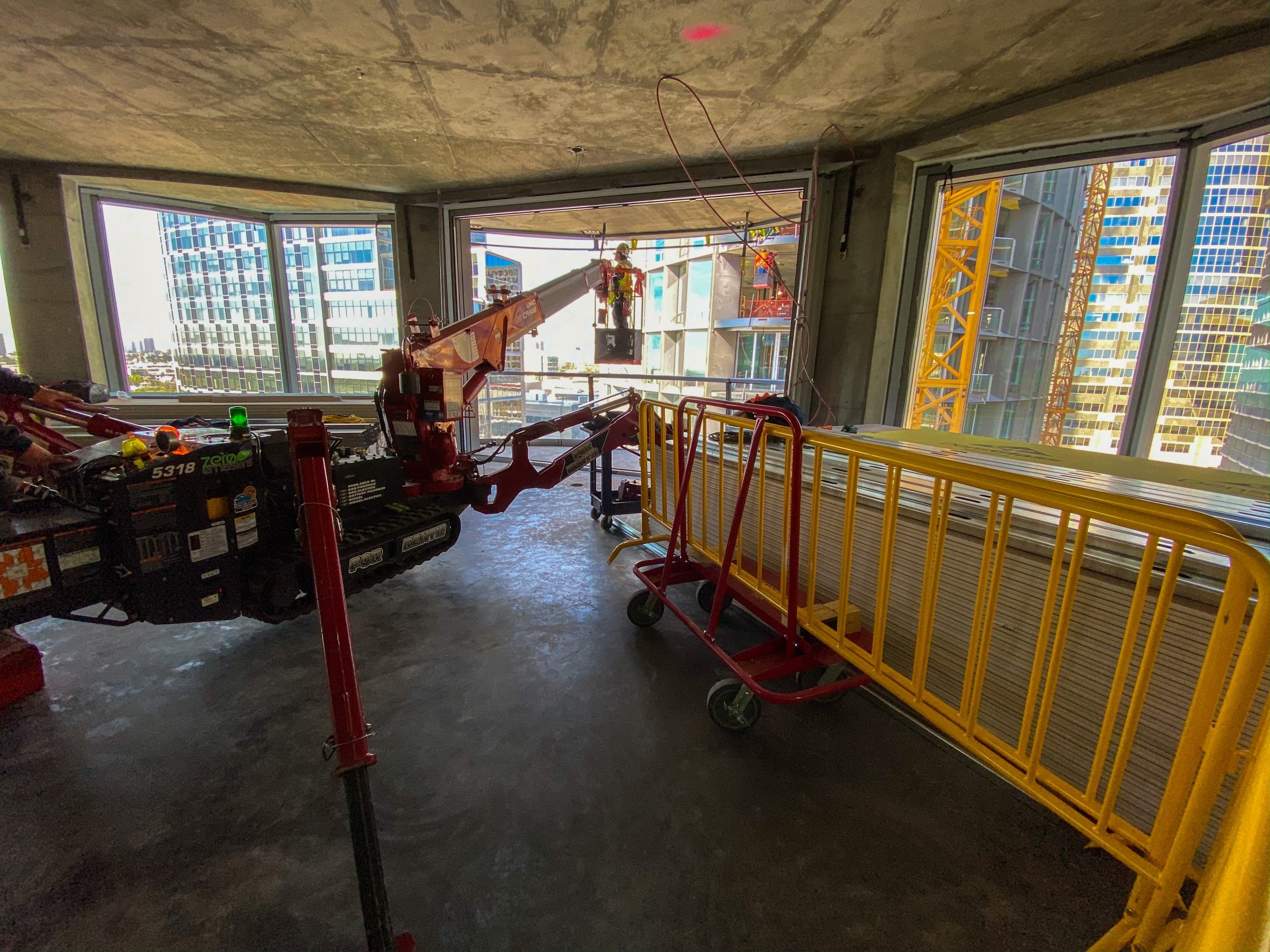 SPYDERCRANE mini crane inside a high-rise under construction
